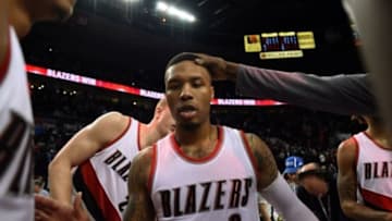 Feb 23, 2016; Portland, OR, USA; Portland Trail Blazers guard Damian Lillard (0) celebrates with teammates after defeating the Brooklyn Nets 112-104 at Moda Center at the Rose Quarter. Lillard finished the game with 34 points. Mandatory Credit: Godofredo Vasquez-USA TODAY Sports