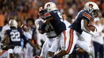 Auburn football running back Shaun Shivers (8) is tripped up by Alabama linebacker Jaylen Moody (42) on a kick return in second half action in the Iron Bowl at Jordan-Hare Stadium in Auburn, Ala., on Saturday, November 30, 2019.