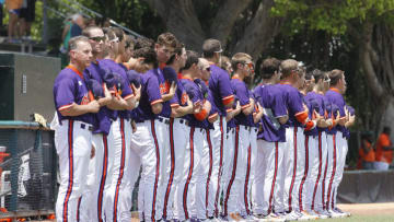 CORAL GABLES, FL - APRIL 21: The Clemson Tigers stand during a moment of silence for the victims of the Boston Marathon Bombing and the national anthem prior to the game against the Miami Hurricanes on April 21, 2013 at Alex Rodriguez Park at Mark Light Field in Coral Gables, Florida. Miami defeated Clemson 7-0. (Photo by Joel Auerbach/Getty Images)