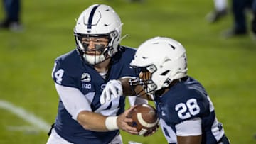 STATE COLLEGE, PA - OCTOBER 31: Sean Clifford #14 of the Penn State Nittany Lions hands the ball off to Devyn Ford #28 before the game against the Ohio State Buckeyes at Beaver Stadium on October 31, 2020 in State College, Pennsylvania. (Photo by Scott Taetsch/Getty Images)