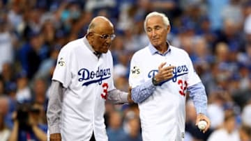 LOS ANGELES, CA - NOVEMBER 01: Former Los Angeles Dodgers players Don Newcombe and Sandy Koufax walk on the field for the ceremonial first pitch before game seven of the 2017 World Series between the Houston Astros and the Los Angeles Dodgers at Dodger Stadium on November 1, 2017 in Los Angeles, California. (Photo by Ezra Shaw/Getty Images)