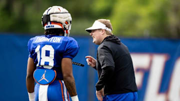 Florida Gators safety Bryce Thornton (18) talks with Florida Gators defensive coordinator Austin Armstrong during spring football practice at Sanders Outdoor Practice Fields in Gainesville, FL on Tuesday, March 21, 2023. [Matt Pendleton/Gainesville Sun]Ncaa Football Florida Gators Spring Football Practice