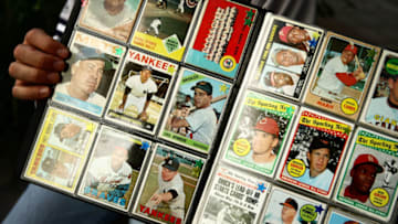 NEW YORK - SEPTEMBER 21: A man sells vintage baseball cards prior to the start of the last game at Yankee Stadium between the Baltimore Orioles and the New York Yankees on September 21, 2008 at Yankee Stadium in the Bronx borough of New York City. Yankee Stadium held it's inaugural game on April 18, 1923 against the Boston Red Sox and tonight's match will be the final game to be played at the historic stadium. During it's 85 years as ''The Home of Champions,'' the stadium has also been known as ''The House that Ruth Built'' and ''The Cathedral.'' The stadium has been host to 33 World Series, three Papal visits and has been visited by legends such as Babe Ruth, Joe DiMaggio, Yogi Bera, Mickey Mantle and boxing great Muhummad Ali. In 2009 the Yankees will move across the street to a newly constructed stadium estimated to cost $1.3 billion. (Photo by Chris McGrath/Getty Images)
