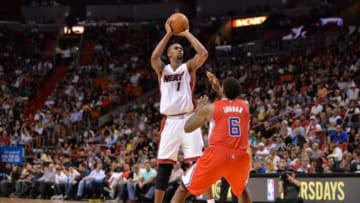 Nov 20, 2014; Miami, FL, USA; Miami Heat center Chris Bosh (1) shoots over Los Angeles Clippers center DeAndre Jordan (6) during the second half at American Airlines Arena. Mandatory Credit: Steve Mitchell-USA TODAY Sports