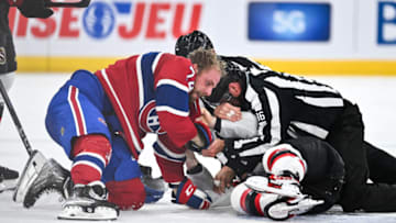 MONTREAL, CANADA - SEPTEMBER 27: Brandon Gignac #74 of the Montreal Canadiens fights against Donovan Sebrango #37 of the Ottawa Senators during the second period at the Bell Centre on September 27, 2023 in Montreal, Quebec, Canada. (Photo by Minas Panagiotakis/Getty Images)