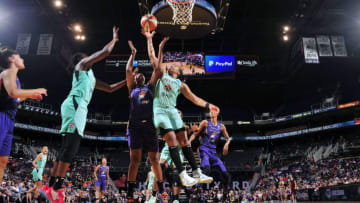 PHOENIX, AZ - AUGUST 18: Tanisha Wright #30 of the New York Liberty goes for a rebound against the Phoenix Mercury on August 18. 2019 at Talking Stick Resort Arena in Phoenix, Arizona. NOTE TO USER: User expressly acknowledges and agrees that, by downloading and/or using this photograph, user is consenting to the terms and conditions of the Getty Images License Agreement. Mandatory Copyright Notice: Copyright 2019 NBAE (Photo by Barry Gossage/NBAE via Getty Images)