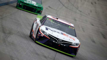 DOVER, DELAWARE - OCTOBER 06: Denny Hamlin, driver of the #11 FedEx Express Toyota, leads Kyle Larson, driver of the #42 Clover Chevrolet, during the Monster Energy NASCAR Cup Series Drydene 400 at Dover International Speedway on October 06, 2019 in Dover, Delaware. (Photo by Jeff Zelevansky/Getty Images)
