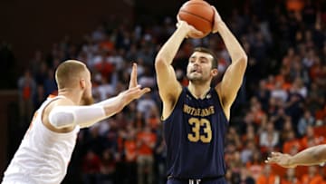 CHARLOTTESVILLE, VA - FEBRUARY 16: John Mooney #33 of the Notre Dame Fighting Irish shoots over Jack Salt #33 of the Virginia Cavaliers in the first half during a game at John Paul Jones Arena on February 16, 2019 in Charlottesville, Virginia. (Photo by Ryan M. Kelly/Getty Images)