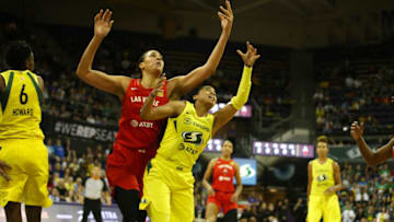 SEATTLE, WA- JULY 19: Liz Cambage #8 of the Las Vegas Aces battles for possession of the ball during the game against Jordin Canada #21 of the Seattle Storm on July 19, 2019 at the Alaska Airlines Arena, in Seattle, Washington. NOTE TO USER: User expressly acknowledges and agrees that, by downloading and or using this photograph, User is consenting to the terms and conditions of the Getty Images License Agreement. Mandatory Copyright Notice: Copyright 2019 NBAE (Photo by Scott Eklund/NBAE via Getty Images)