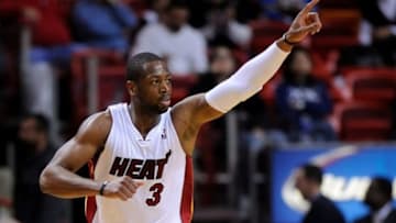 Jan 7, 2014; Miami, FL, USA; Miami Heat shooting guard Dwyane Wade (3) reacts from the court against the New Orleans Pelicans during the second half at American Airlines Arena. The Heat won 107-88. Mandatory Credit: Steve Mitchell-USA TODAY Sports