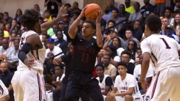 Jul 10, 2016; North Augusta, SC, USA; Mokan Elite player Trae Young (11) looks to pass the ball while being defended by PSA Cardinals players Hasahn French (25) and Quade Green (1) during the first half of the Nike Peach Jam Finals at the Riverview Park Activity Center. Mokan won 93-65. Mandatory Credit: Joshua S. Kelly-USA TODAY Sports