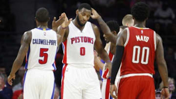 Oct 9, 2014; Auburn Hills, MI, USA; Detroit Pistons center Andre Drummond (0) high fives guard Kentavious Caldwell-Pope (5) during the second quarter against the Milwaukee Bucks at The Palace of Auburn Hills. Mandatory Credit: Raj Mehta-USA TODAY Sports
