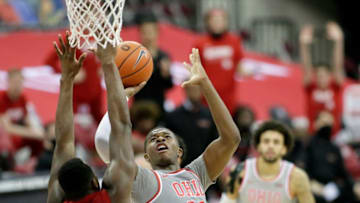 Ohio State Buckeyes forward E.J. Liddell (32) is guarded by Rutgers Scarlet Knights forward Mamadou Doucoure (11) during the second half of Wednesday's NCAA Division I basketball game at Value City Arena in Columbus, Oh. on December 23, 2020. Ohio State won the game 80-68.Osu Mbk Vs Rutgers Bjp