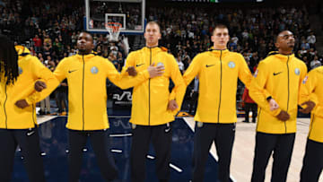SALT LAKE CITY, UT - OCTOBER 18: Paul Millsap #4 and Nikola Jokic #15 of the Denver Nuggets with their teammates stand for the National Anthem before the game against the Utah Jazz on October 18, 2017 at vivint.SmartHome Arena in Salt Lake City, Utah. NOTE TO USER: User expressly acknowledges and agrees that, by downloading and or using this Photograph, User is consenting to the terms and conditions of the Getty Images License Agreement. Mandatory Copyright Notice: Copyright 2017 NBAE (Photo by Garrett Ellwood/NBAE via Getty Images)