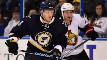 Nov 25, 2014; St. Louis, MO, USA; St. Louis Blues defenseman Carl Gunnarsson (4) chases a loose puck against the Ottawa Senators during the first period at Scottrade Center. Mandatory Credit: Jasen Vinlove-USA TODAY Sports