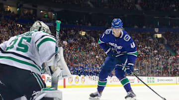 VANCOUVER, BC - MARCH 30: Elias Pettersson #40 of the Vancouver Canucks skates in on Anton Khudobin #35 of the Dallas Stars in the shootout during their NHL game at Rogers Arena March 30, 2019 in Vancouver, British Columbia, Canada. (Photo by Jeff Vinnick/NHLI via Getty Images)"n