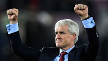 SWANSEA, WALES - MAY 08: Mark Hughes, Manager of Southampton celebrates during the Premier League match between Swansea City and Southampton at Liberty Stadium on May 8, 2018 in Swansea, Wales. (Photo by Stu Forster/Getty Images)