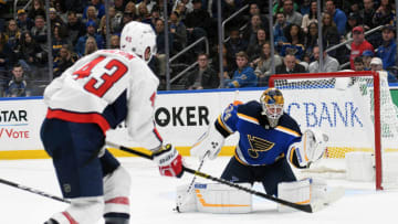 ST. LOUIS, MO. - JANUARY 03: St. Louis Blues goalie Jake Allen (34) makes a glove save on a shot by Washington Capitals rightwing Tom Wilson (43) during an NHL game between the Washington Capitals and the St. Louis Blues on January 03, 2019, at Enterprise Center, St. Louis, MO. (Photo by Keith Gillett/Icon Sportswire via Getty Images)
