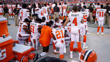CLEVELAND, OH - AUGUST 21: A group of Cleveland Browns players kneel in a circle in protest during the national anthem prior to a preseason game against the New York Giants at FirstEnergy Stadium on August 21, 2017 in Cleveland, Ohio. (Photo by Joe Robbins/Getty Images)