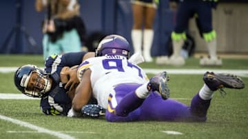 Aug 18, 2016; Seattle, WA, USA; Seattle Seahawks quarterback Russell Wilson (3) is sacked by Minnesota Vikings defensive end Everson Griffen (97) during the first quarter at CenturyLink Field. Mandatory Credit: Troy Wayrynen-USA TODAY Sports