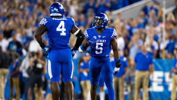 Sep 11, 2021; Lexington, Kentucky, USA; Kentucky Wildcats defensive end Josh Paschal (4) and linebacker DeAndre Square (5) celebrate a defensive play during the fourth quarter against the Missouri Tigers at Kroger Field. Mandatory Credit: Jordan Prather-USA TODAY Sports