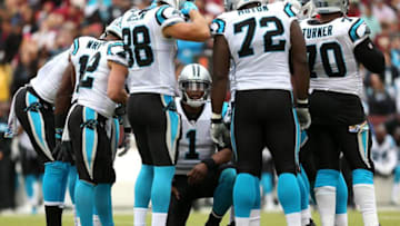 LANDOVER, MD - OCTOBER 14: Quarterback Cam Newton #1 of the Carolina Panthers huddles with teammates in the third quarter against the Washington Redskins at FedExField on October 14, 2018 in Landover, Maryland. (Photo by Will Newton/Getty Images)