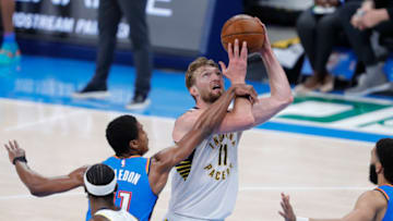 May 1, 2021; Oklahoma City, Oklahoma, USA; Indiana Pacers forward Domantas Sabonis (11) is fouled by Oklahoma City Thunder guard Theo Maledon (11) on the way to the basket during the third quarter at Chesapeake Energy Arena. Mandatory Credit: Alonzo Adams-USA TODAY Sports