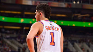 PHOENIX, AZ - NOVEMBER 10: Devin Booker #1 of the Phoenix Suns looks on during the game against the Orlando Magic on November 10, 2017 at Talking Stick Resort Arena in Phoenix, Arizona. NOTE TO USER: User expressly acknowledges and agrees that, by downloading and or using this photograph, user is consenting to the terms and conditions of the Getty Images License Agreement. Mandatory Copyright Notice: Copyright 2017 NBAE (Photo by Barry Gossage/NBAE via Getty Images)