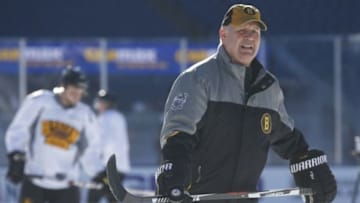 Dec 31, 2015; Foxborough, MA, USA; Boston Bruins manager Claude Julien (C) skates on the ice during practice the day prior to the Winter Classic hockey game at Gillette Stadium. Mandatory Credit: Greg M. Cooper-USA TODAY Sports