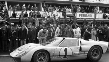 Ken Miles, Denny Hulme, Ford MkII, 24 Hours of Le Mans, Le Mans, 19 June 1966. Denny Hulme and teammate Ken Miles at the finish of the 1966 24 Hours of Le Mans where they finished second driving the Ford MkII. (Photo by Bernard Cahier/Getty Images)