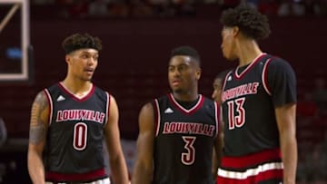 Jan 10, 2016; Clemson, SC, USA; Louisville Cardinals guard Damion Lee (0) guard Trey Lewis (3) and forward Raymond Spalding (13) react during the second half against the Clemson Tigers at Bon Secours Wellness Arena. Tigers won 66-62. Mandatory Credit: Joshua S. Kelly-USA TODAY Sports