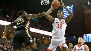 CHARLOTTESVILLE, VA - JANUARY 05: De'Andre Hunter #12 of the Virginia Cavaliers shoots over Mfiondu Kabengele #25 of the Florida State Seminoles in the second half during a game at John Paul Jones Arena on January 5, 2019 in Charlottesville, Virginia. (Photo by Ryan M. Kelly/Getty Images)