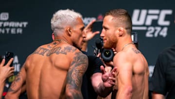 May 6, 2022; Phoenix, Arizona, USA; UFC fighter Charles Oliveira (left) faces off with Justin Gaethje during weigh ins for UFC 274 at the Arizona Federal Theatre. Mandatory Credit: Mark J. Rebilas-USA TODAY Sports