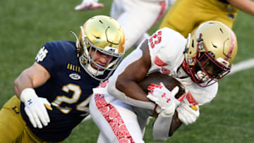 Nov 14, 2020; Chestnut Hill, Massachusetts, USA; Notre Dame Fighting Irish linebacker Jack Kiser (24) tackles Boston College Eagles running back Travis Levy (23) during the first half at Alumni Stadium. Mandatory Credit: Brian Fluharty-USA TODAY Sports