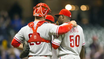 Apr 22, 2016; Milwaukee, WI, USA; Philadelphia Phillies catcher Cameron Rupp (29) talks with pitcher Hector Neris (50) prior to the eighth inning against the Milwaukee Brewers at Miller Park. Mandatory Credit: Jeff Hanisch-USA TODAY Sports