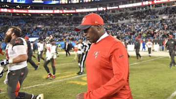 Jan 3, 2016; Charlotte, NC, USA; Tampa Bay Buccaneers head coach Lovie Smith walks on to the field at the end of the game. The Panthers defeated the Buccaneers 38-10 at Bank of America Stadium. Mandatory Credit: Bob Donnan-USA TODAY Sports