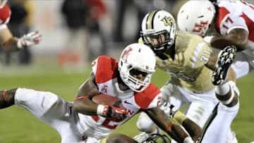 Nov 9, 2013; Orlando, FL, USA; Houston Cougars running back Ryan Jackson (22) being tackled in the first half of the game at Bright House Networks Stadium. Mandatory Credit: Brad Barr-USA TODAY Sports