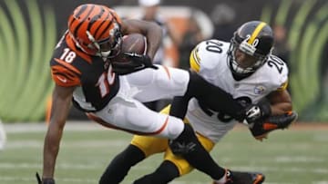 Dec 13, 2015; Cincinnati, OH, USA; Pittsburgh Steelers safety Will Allen (20) tackles Cincinnati Bengals wide receiver A.J. Green (18) in the second half at Paul Brown Stadium. The Steelers won 33-20. Mandatory Credit: Mark Zerof-USA TODAY Sports