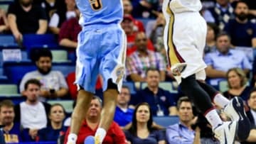 Mar 31, 2016; New Orleans, LA, USA; New Orleans Pelicans forward Dante Cunningham (44) dunks over Denver Nuggets guard JaKarr Sampson (9) during the first quarter of a game at the Smoothie King Center. Mandatory Credit: Derick E. Hingle-USA TODAY Sports