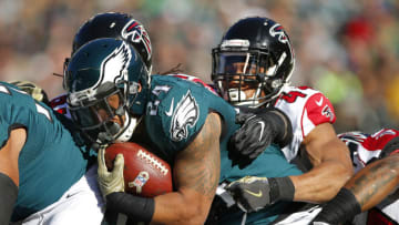 PHILADELPHIA, PA - NOVEMBER 13: Ryan Mathews #24 of the Philadelphia Eagles runs for a first down and is tackled by Vic Beasley Jr. #44 and Courtney Upshaw #91 of the Atlanta Falcons in the first quarter during a game at Lincoln Financial Field on November 13, 2016 in Philadelphia, Pennsylvania. (Photo by Rich Schultz/Getty Images)