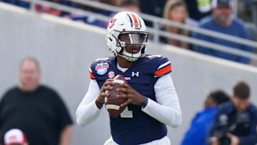 Auburn footballDec 28, 2021; Birmingham, Alabama, USA; Auburn Tigers quarterback TJ Finley (1) looks to pass against the Houston Cougars during the first half of the 2021 Birmingham Bowl at Protective Stadium. Mandatory Credit: Marvin Gentry-USA TODAY Sports