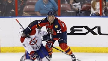 Mar 29, 2014; Sunrise, FL, USA; Florida Panthers center Scott Gomez (23) battles with Montreal Canadiens defenseman P.K. Subban (76) in the third period at BB&T Center. The Canadiens won 4-1. Mandatory Credit: Robert Mayer-USA TODAY Sports