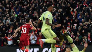 Liverpool's Portuguese striker Diogo Jota (L) celebrates after scoring their second goal during the English Premier League football match between Liverpool and Arsenal at Anfield in Liverpool, north west England on November 20, 2021. - - RESTRICTED TO EDITORIAL USE. No use with unauthorized audio, video, data, fixture lists, club/league logos or 'live' services. Online in-match use limited to 120 images. An additional 40 images may be used in extra time. No video emulation. Social media in-match use limited to 120 images. An additional 40 images may be used in extra time. No use in betting publications, games or single club/league/player publications. (Photo by Paul ELLIS / AFP) / RESTRICTED TO EDITORIAL USE. No use with unauthorized audio, video, data, fixture lists, club/league logos or 'live' services. Online in-match use limited to 120 images. An additional 40 images may be used in extra time. No video emulation. Social media in-match use limited to 120 images. An additional 40 images may be used in extra time. No use in betting publications, games or single club/league/player publications. / RESTRICTED TO EDITORIAL USE. No use with unauthorized audio, video, data, fixture lists, club/league logos or 'live' services. Online in-match use limited to 120 images. An additional 40 images may be used in extra time. No video emulation. Social media in-match use limited to 120 images. An additional 40 images may be used in extra time. No use in betting publications, games or single club/league/player publications. (Photo by PAUL ELLIS/AFP via Getty Images)