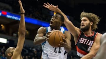 Dec 10, 2014; Minneapolis, MN, USA; Minnesota Timberwolves guard Andrew Wiggins (22) is fouled by Portland Trail Blazers center Robin Lopez (42) during the fourth quarter at Target Center. The Timberwolves defeated the Trail Blazers 90-82. Mandatory Credit: Brace Hemmelgarn-USA TODAY Sports