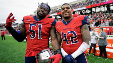 HOUSTON, TX - MARCH 7: Edmond Robinson #51 and Beniquez Brown #42 of the Houston Roughnecks pose for a photo during the XFL game against the Seattle Dragons at TDECU Stadium on March 7, 2020 in Houston, Texas. (Photo by Thomas Campbell/XFL via Getty Images)