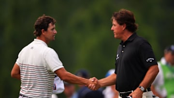 ROCHESTER, NY - AUGUST 08: (L-R) Adam Scott of Australia and Phil Mickelson of the United States finish their round on the 18th hole during the first round of the 95th PGA Championship on August 8, 2013 in Rochester, New York. (Photo by Stuart Franklin/Getty Images)