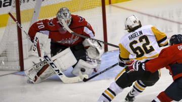 WASHINGTON, DC - NOVEMBER 07: Washington Capitals goaltender Braden Holtby (70) makes a third period save on a shot by Pittsburgh Penguins left wing Carl Hagelin (62) on November 7, 2018, at the Capital One Arena in Washington, D.C. The Washington Capitals defeated the Pittsburgh Penguins, 2-1. (Photo by Mark Goldman/Icon Sportswire via Getty Images)