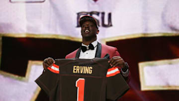CHICAGO, IL - APRIL 30: Cameron Erving of the Florida State Seminoles holds up a jersey after being picked