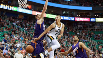 Oct 12, 2016; Salt Lake City, UT, USA; Utah Jazz guard Dante Exum (11) tries to pass the ball around the back of Phoenix Suns center Alex Len (21) during the second quarter at Vivint Smart Home Arena. Mandatory Credit: Chris Nicoll-USA TODAY Sports