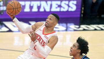 Dec 11, 2019; Cleveland, OH, USA; Houston Rockets guard Russell Westbrook (0) drives to the basket against Cleveland Cavaliers guard Collin Sexton (right) in the third quarter at Rocket Mortgage FieldHouse. Mandatory Credit: David Richard-USA TODAY Sports